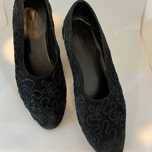 Vintage Black suede flats with a ribbon type embroidered swirl covering shoe